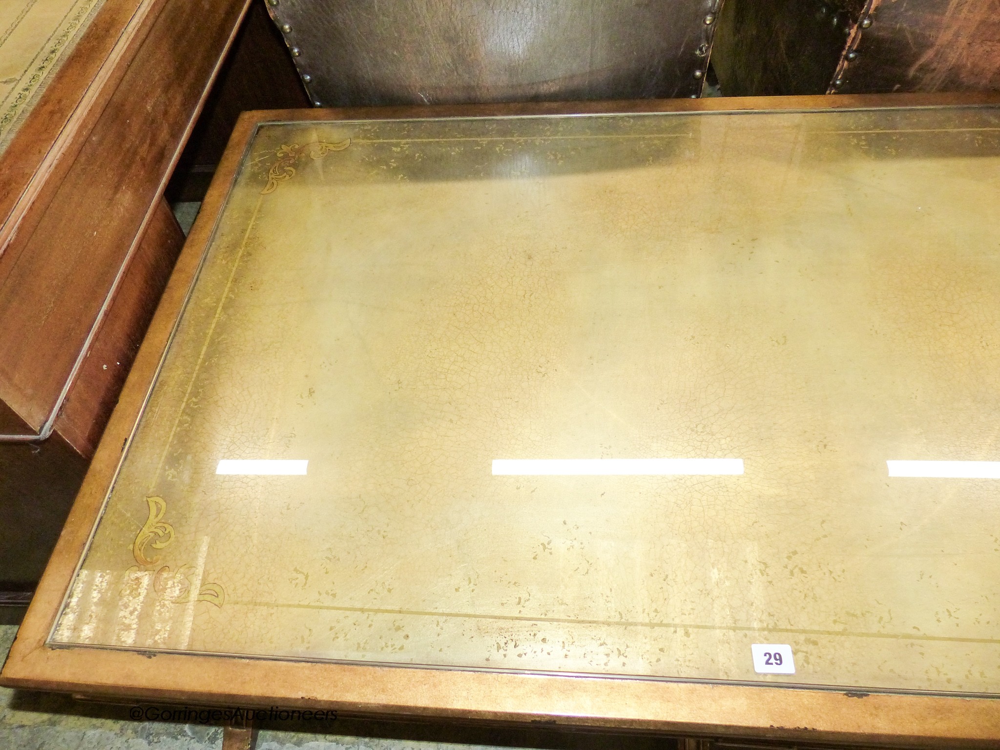An Italian style gilt and glass 'X' frame coffee table fitted end drawers, length 132cm, depth 80cm, height 51cm